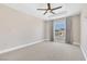 Bright and airy bedroom with large window and carpet flooring at 30 Strada Di Villaggio # 151, Henderson, NV 89011