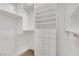 Large walk-in closet with shelves and hanging rods at 30 Strada Di Villaggio # 151, Henderson, NV 89011