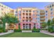 Upscale condo building with manicured lawn and inviting entrance at 30 Strada Di Villaggio # 151, Henderson, NV 89011