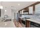 Modern kitchen with stainless steel appliances and granite countertops at 30 Strada Di Villaggio # 151, Henderson, NV 89011