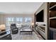 Elegant living room with fireplace and large windows at 30 Strada Di Villaggio # 151, Henderson, NV 89011
