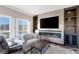 Cozy living room with fireplace and built-in shelving at 30 Strada Di Villaggio # 151, Henderson, NV 89011