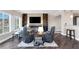 Spacious living room with fireplace and built-in shelving at 30 Strada Di Villaggio # 151, Henderson, NV 89011