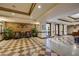 Spacious lobby with elegant tiled floors and comfortable seating at 30 Strada Di Villaggio # 151, Henderson, NV 89011