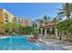 Inviting pool area with comfortable seating and landscaping at 30 Strada Di Villaggio # 151, Henderson, NV 89011