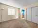 Simple bedroom with carpet and access to a full bathroom at 3350 Stacey Lyn Dr, Las Vegas, NV 89117