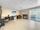 Spacious Gathering room features fireplace, home office, and sliding glass door to backyard at 3350 Stacey Lyn Dr, Las Vegas, NV 89117