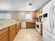 Spacious kitchen with light wood cabinets and white appliances at 3350 Stacey Lyn Dr, Las Vegas, NV 89117