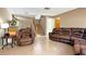 Living room with leather couches, a side chair and view of staircase at 3350 Stacey Lyn Dr, Las Vegas, NV 89117