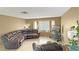 Living room features a large sectional sofa, bay window, and a TV stand at 3350 Stacey Lyn Dr, Las Vegas, NV 89117