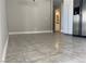 Kitchen area with stainless steel refrigerator and tile floors at 3614 Calmosa, Las Vegas, NV 89103