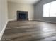 Living room with fireplace and wood-look floors at 3614 Calmosa, Las Vegas, NV 89103