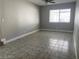 Bright living room with tile flooring and ceiling fan at 3614 Calmosa, Las Vegas, NV 89103