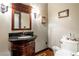 Powder room with dark wood vanity and granite countertop at 362 Rainbow Canyon Blvd, Las Vegas, NV 89124