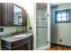 Clean bathroom with granite vanity and a walk-in shower at 362 Rainbow Canyon Blvd, Las Vegas, NV 89124
