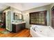 Elegant bathroom with double vanity, soaking tub, and walk-in shower at 362 Rainbow Canyon Blvd, Las Vegas, NV 89124