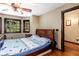 Cozy bedroom with hardwood floors and a comfortable bed at 362 Rainbow Canyon Blvd, Las Vegas, NV 89124