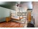Spacious main bedroom with hardwood floors, a large bed, and a fireplace at 362 Rainbow Canyon Blvd, Las Vegas, NV 89124