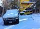 Hummers parked in snowy driveway near yellow house at 362 Rainbow Canyon Blvd, Las Vegas, NV 89124