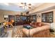 Gathering room with leather sofas, built-in shelving, and a large flat-screen TV at 362 Rainbow Canyon Blvd, Las Vegas, NV 89124