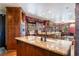 Kitchen boasts granite countertops, custom cabinetry, and a breakfast bar at 362 Rainbow Canyon Blvd, Las Vegas, NV 89124