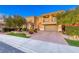 Two-story house with attached garage and landscaping at 38 Benevolo Dr, Henderson, NV 89011