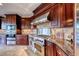 Modern kitchen features high-end appliances and custom cabinetry at 38 Benevolo Dr, Henderson, NV 89011