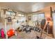 Brightly lit home gym featuring weightlifting equipment and mirrored walls at 3940 Spencer St, Las Vegas, NV 89119