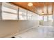 Bright sunroom with wood ceiling and multiple windows at 429 Ash St, Boulder City, NV 89005