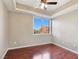 A well-lit bedroom with a large window and laminate wood flooring at 43 E Agate Ave # 403, Las Vegas, NV 89123