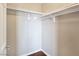 A walk-in closet with built-in shelving and laminate wood flooring at 43 E Agate Ave # 403, Las Vegas, NV 89123