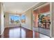 Open dining room with hardwood floors, large windows providing ample natural light, and access to the balcony at 43 E Agate Ave # 403, Las Vegas, NV 89123