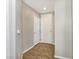 Inviting hallway with tiled flooring, featuring neutral paint tones and white doors leading to various rooms at 43 E Agate Ave # 403, Las Vegas, NV 89123