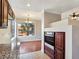 Kitchen with granite countertops next to dining area with hardwood flooring and oven at 43 E Agate Ave # 403, Las Vegas, NV 89123