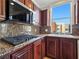 Stylish kitchen with stainless appliances, gas range, and granite countertops at 43 E Agate Ave # 403, Las Vegas, NV 89123