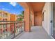 Balcony area overlooking colorful buildings and featuring a sliding glass door at 43 E Agate Ave # 403, Las Vegas, NV 89123