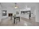 Open kitchen with gray cabinetry, stainless steel appliances, and breakfast bar at 4420 Resthaven Cir, North Las Vegas, NV 89032