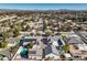 Aerial view showing a large house with a pool and a large yard, in a quiet neighborhood at 5110 N Valadez St, Las Vegas, NV 89149