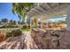 Brick patio, pergola, and rock water feature at 5110 N Valadez St, Las Vegas, NV 89149
