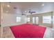 Finished basement room with red carpet and ceiling fans at 5110 N Valadez St, Las Vegas, NV 89149