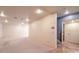 Large, open basement area with neutral carpeting at 5110 N Valadez St, Las Vegas, NV 89149