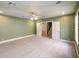 Large basement room with access to stairs and carpet at 5110 N Valadez St, Las Vegas, NV 89149