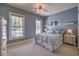 Bright bedroom with a comfortable bed and large windows at 5110 N Valadez St, Las Vegas, NV 89149