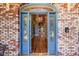 Inviting entry with blue doors and hardwood floors at 5110 N Valadez St, Las Vegas, NV 89149