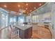 Large kitchen with island, stainless steel appliances and hardwood floors at 5110 N Valadez St, Las Vegas, NV 89149