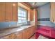 Laundry room with sink, cabinets, and washer/dryer at 5110 N Valadez St, Las Vegas, NV 89149