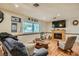 Cozy living room featuring a fireplace and hardwood floors at 5311 Dorrell Ln, Las Vegas, NV 89131