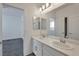 Double vanity bathroom with a view of a bedroom at 6233 Andover Wood Rd, Las Vegas, NV 89113