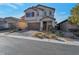 Two-story house with attached garage and landscaped front yard at 6233 Andover Wood Rd, Las Vegas, NV 89113