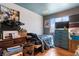 Bedroom with a bed, blue dresser, and window with natural light at 6324 Fairwood Ave, Las Vegas, NV 89107